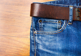 Image showing jeans with leather belt