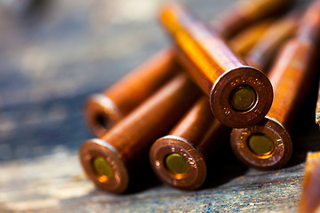 Image showing Still life with five rifle cartridges