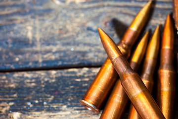 Image showing Still life with five rifle cartridges