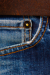 Image showing jeans with a brown leather belt