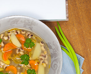 Image showing bean soup with carrots, potatoes, parsley and onions