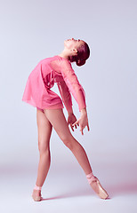 Image showing Young ballerina dancer showing her techniques