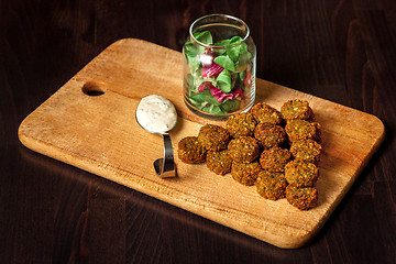 Image showing fresh vegetarian falafel  with sauce, selective focus