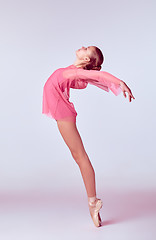 Image showing Young ballerina dancer showing her techniques