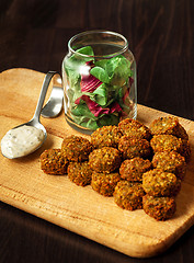 Image showing fresh vegetarian falafel  with sauce, selective focus