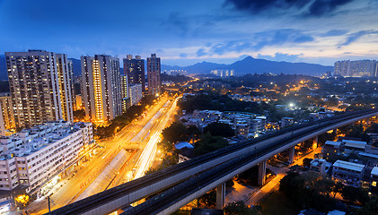 Image showing hong kong urban downtown and high speed train at night