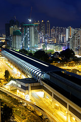 Image showing hong kong urban downtown and high speed train at night