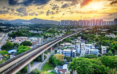 Image showing hong kong urban downtown and sunset speed train