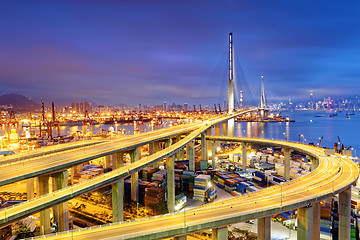 Image showing Container Cargo freight ship with working crane bridge in shipya