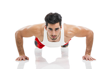 Image showing Athletic man doing push-up