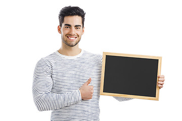 Image showing Man holding a chalkboard