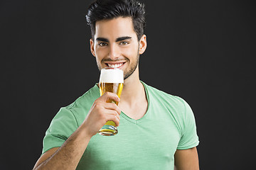 Image showing Young man drinking beer