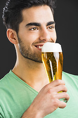 Image showing Young man drinking beer