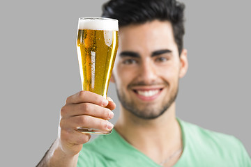 Image showing Young man drinking beer