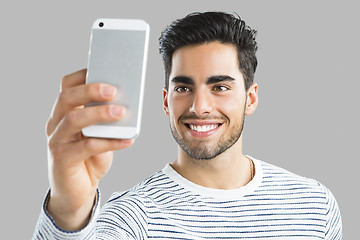 Image showing Handsome man making a selfie