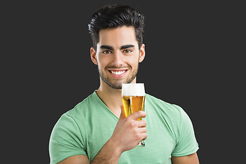 Image showing Young man drinking beer