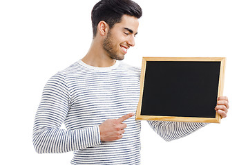 Image showing Man holding a chalkboard