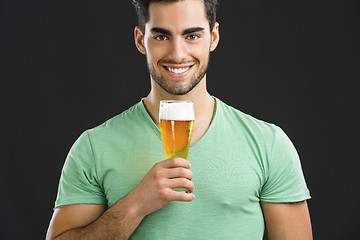 Image showing Young man drinking beer