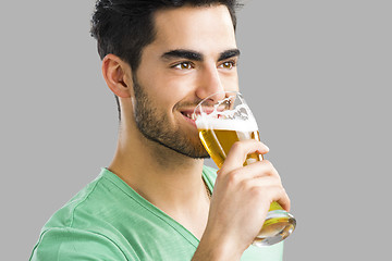 Image showing Young man drinking beer