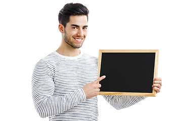 Image showing Man holding a chalkboard