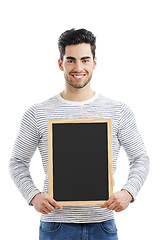 Image showing Man holding a chalkboard