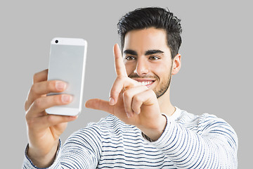 Image showing Handsome man making a selfie