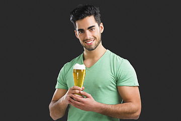 Image showing Young man drinking beer