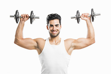 Image showing Athletic man lifting weights