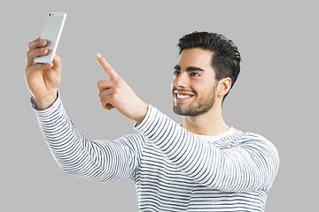 Image showing Handsome man making a selfie