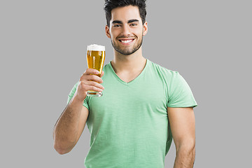 Image showing Young man drinking beer