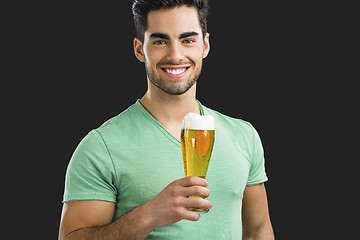 Image showing Young man drinking beer