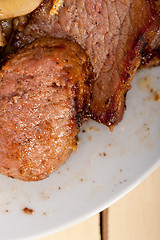 Image showing venison deer game filet and wild mushrooms