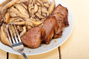 Image showing venison deer game filet and wild mushrooms