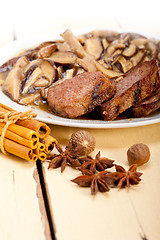 Image showing venison deer game filet and wild mushrooms