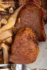 Image showing venison deer game filet and wild mushrooms