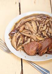 Image showing venison deer game filet and wild mushrooms