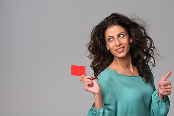 Image showing Business woman holding credit card