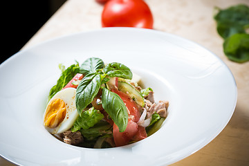 Image showing plate of spring mix salad with strawberry, eggs and tuna