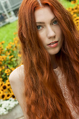 Image showing Long Hair Woman At the Garden looking Afar