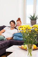 Image showing Happy Couple on the Couch, Looking Into Distance