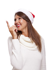 Image showing Attractive smiling woman in a Santa hat