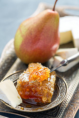 Image showing Brie cheese, honey and pear.