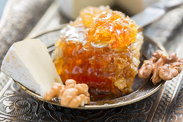 Image showing Honey comb, brie and walnuts.