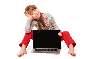 Image showing Little girl sitting on floor showing laptop screen