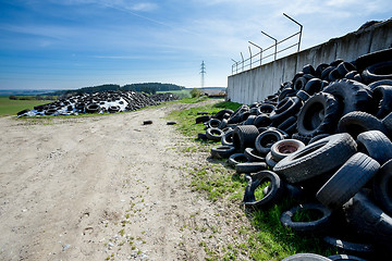 Image showing Pile of old tires in farm