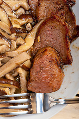 Image showing venison deer game filet and wild mushrooms