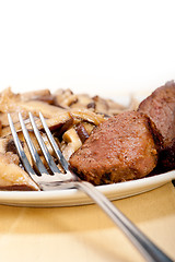 Image showing venison deer game filet and wild mushrooms