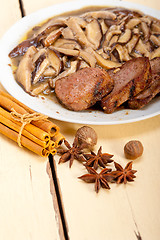 Image showing venison deer game filet and wild mushrooms