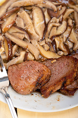 Image showing venison deer game filet and wild mushrooms