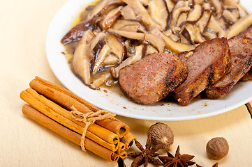 Image showing venison deer game filet and wild mushrooms